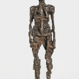 An abstract bronze sculture of a womans body, as seen in a Greek art gallery called Asimis in Santorini