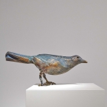 Bronze sculpture of a bird , by Greek contemporary artist Eleni Kolaitou, of the Greek art gallery, Asimis in Santorini