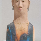 Absract clay sculpture of woman's head inspired by plank- shaped human figures of the archaic era by Greek contemporary artist Eleni Kolaitou of the Greek AK art gallery, Santorini