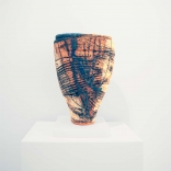 Clay hollow vase, painted with contrasting dark blue and light brown streaks, by Greek contemporary artist Eleni Kolaitou of the Greek art gallery, AK, Santorini Greece.