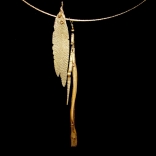 Gold necklace with two long jagged gold pendants by Greek contemporary artist Eleni Kolaitou of the Greek art gallery, AK in Santorini